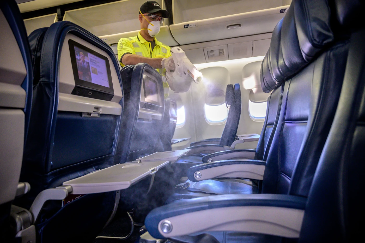 Reference photograph of airline electrostatic spraying; method selection requires aircraft-specific review